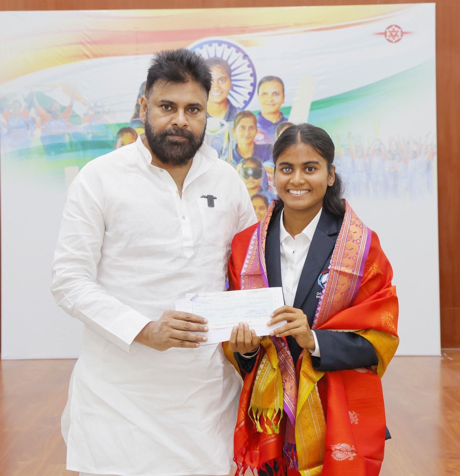 Blind cricket players receiving 5 lakh rupee awards and silk sarees