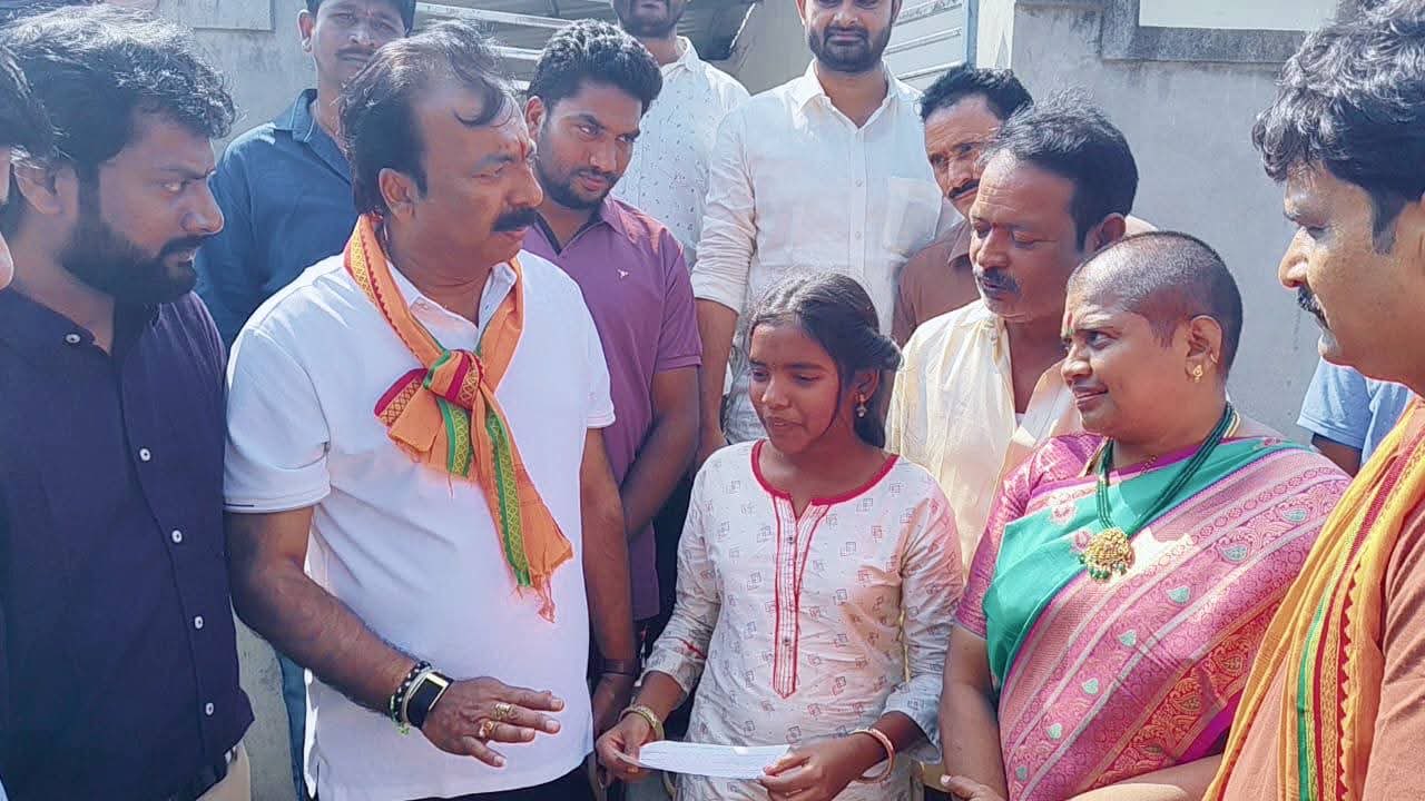 Five thousand rupee financial aid being handed to each orphan