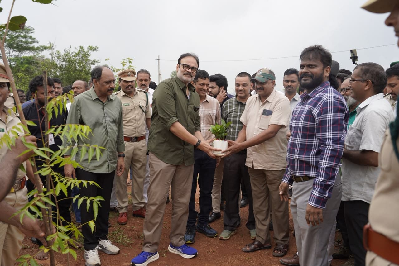 Naga Babu receiving a sapling from forest officials at the Gucchi Reserve Forest plantation site