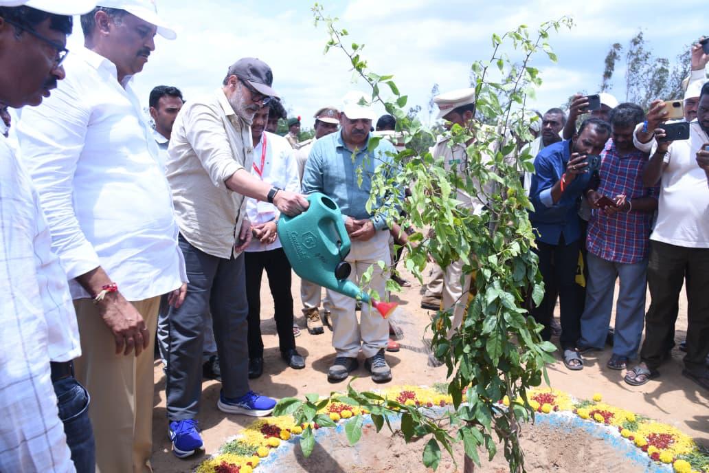 Naga Babu watering a newly planted sapling at the Bapatla district plantation site