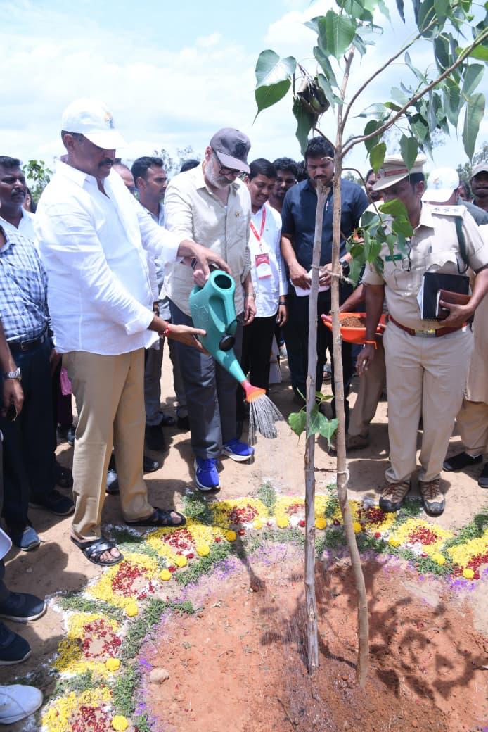 Naga Babu watering the second sapling, a peepal, planted during the Bapatla district visit