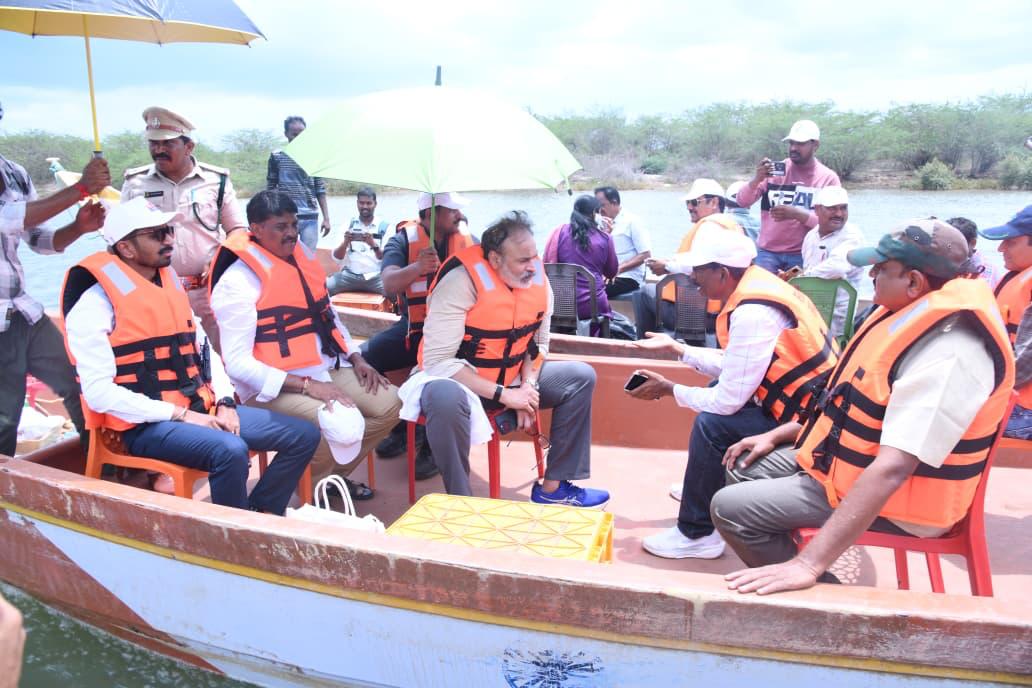 Naga Babu and the AP Green team surveying the coastal creek by boat during the Great Green Wall inspection