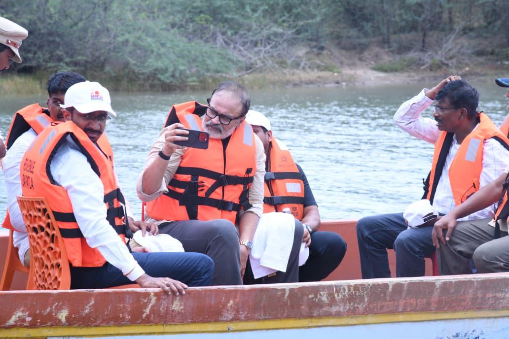 Naga Babu recording the creek-side vegetation during the boat survey with Bapatla forest officials