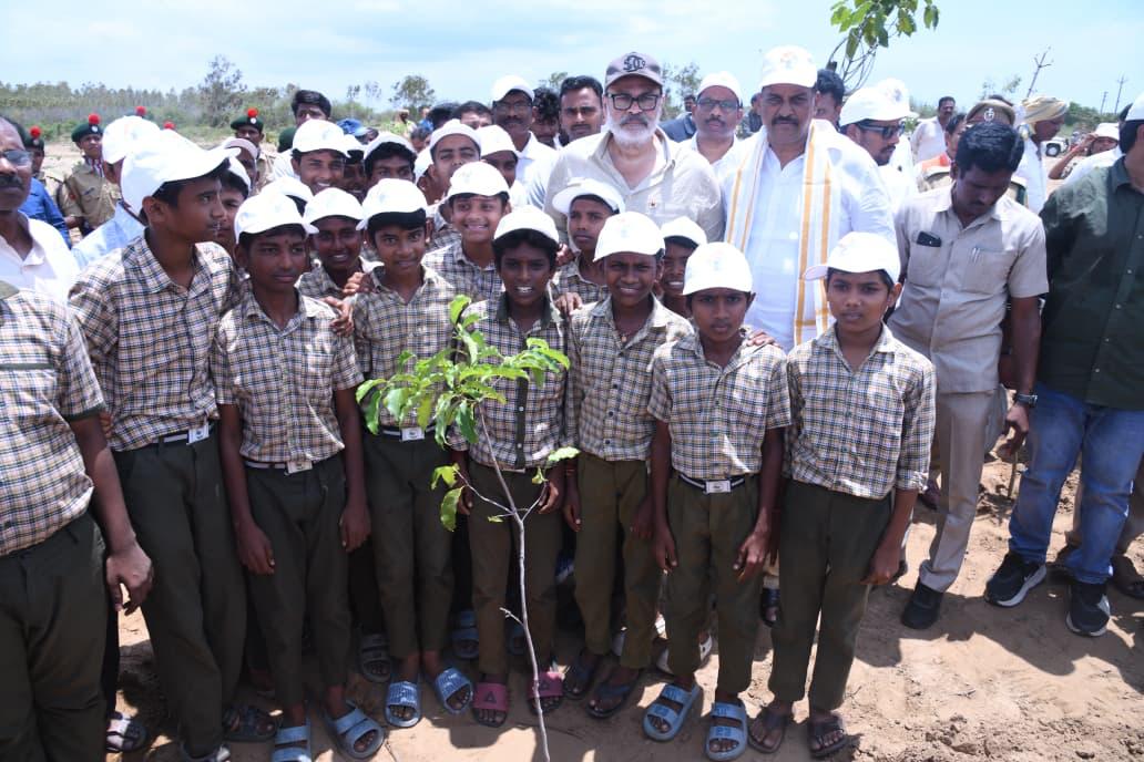 Naga Babu with school students and a newly planted sapling at the Bapatla coastal conservation site