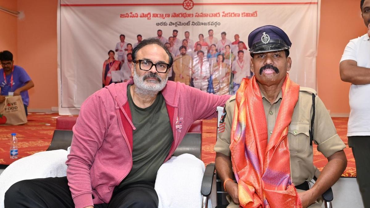 Naga Babu felicitating head constable K. Krishna Murthy for three decades of charity