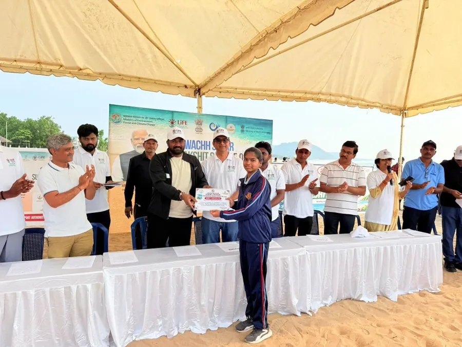 Certificate being presented to a student volunteer at the Swachh Sagar Surakshit Sagar 5.0 programme